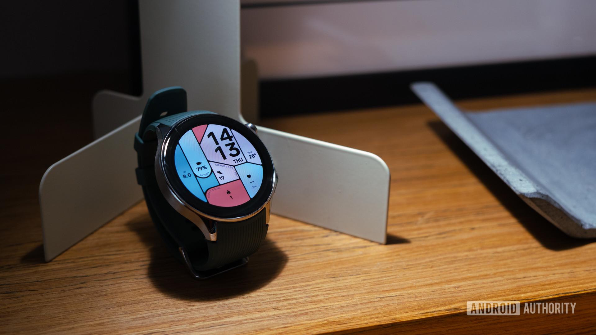 OnePlus-Watch-2-showing-watch-face-on-shelf.jpg