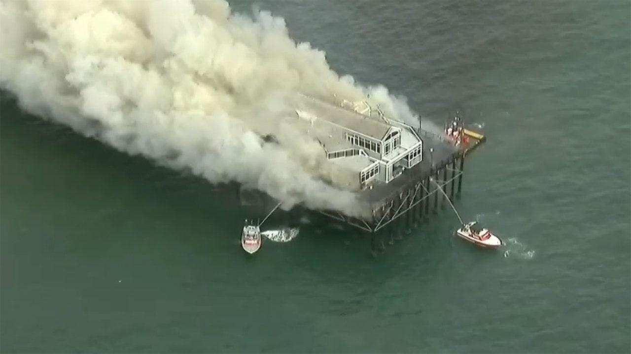 The historic Southern California pier is on fire